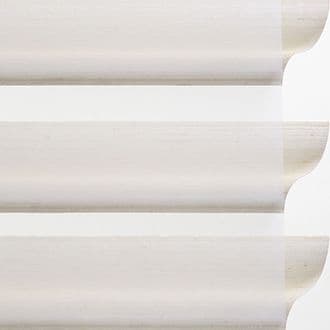 Detailed view of Hunter Douglas sheer window treatments in light fabric.