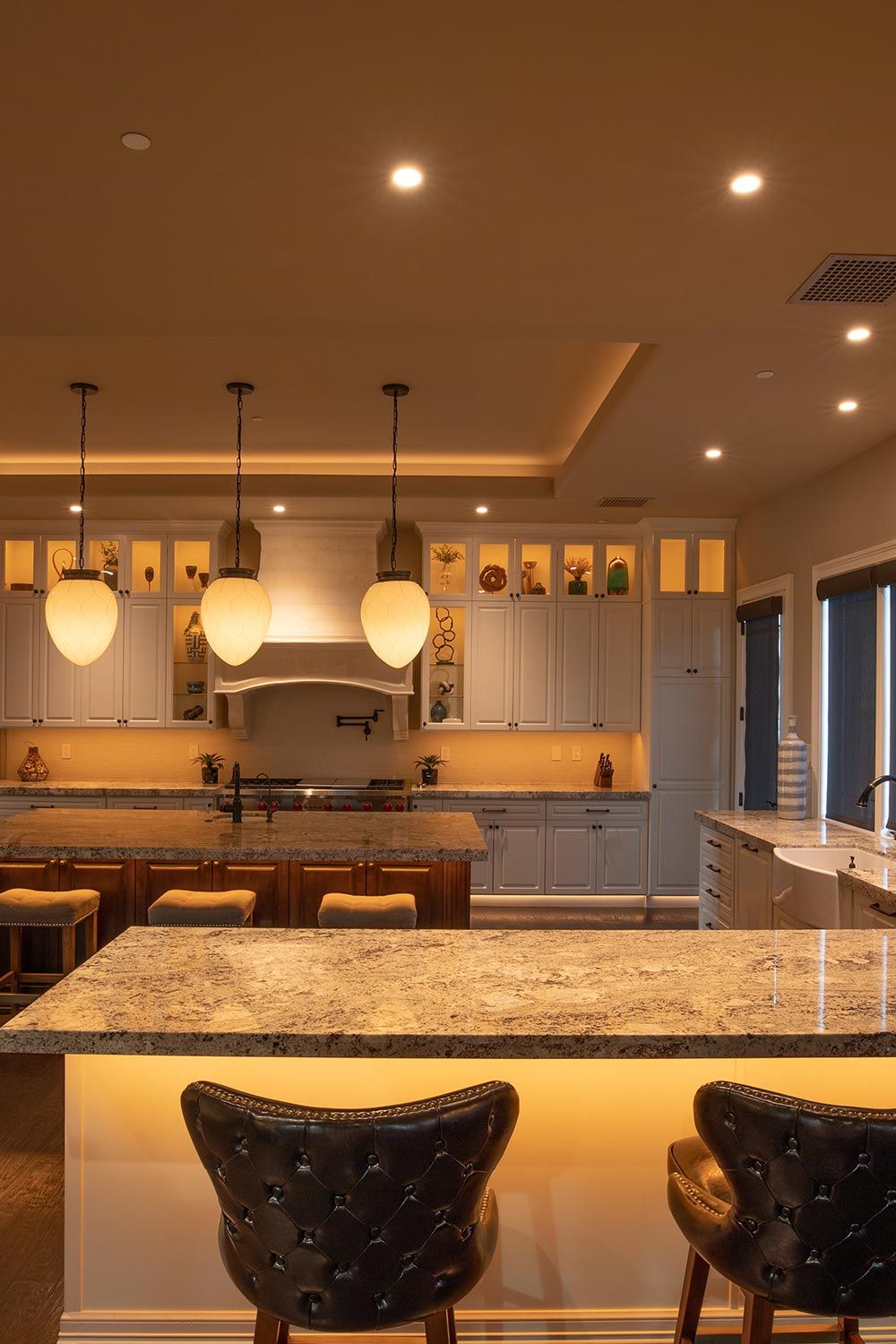 Control4 Vibrant lighting in a modern Kitchen with LED lighting below the counters