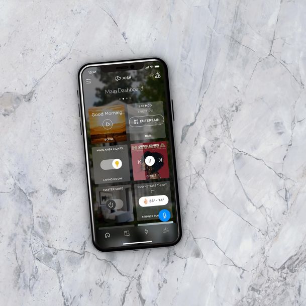 Josh App on an iPhone on top of a black and white marble counter