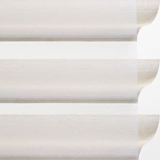 Detailed view of Hunter Douglas sheer window treatments in light fabric.