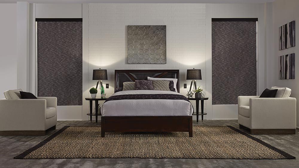 Blackout shades by Lutron in a cool grey bedroom